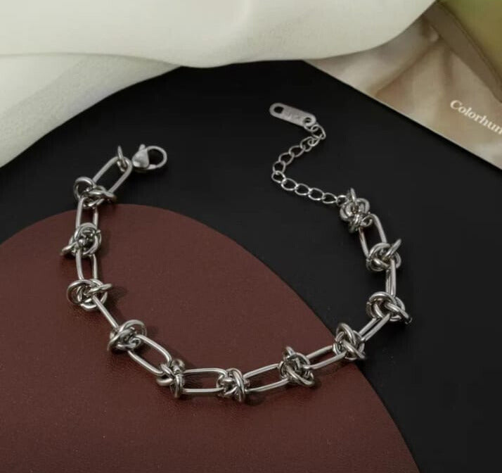 Pulsera elegante en acero inoxidable 304 con enchape de oro de 18 k en color plata