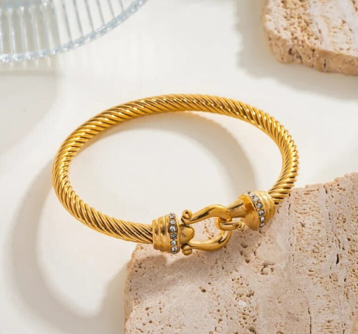 Brazalete herradura en acero inoxidable chapado en oro de 18 k